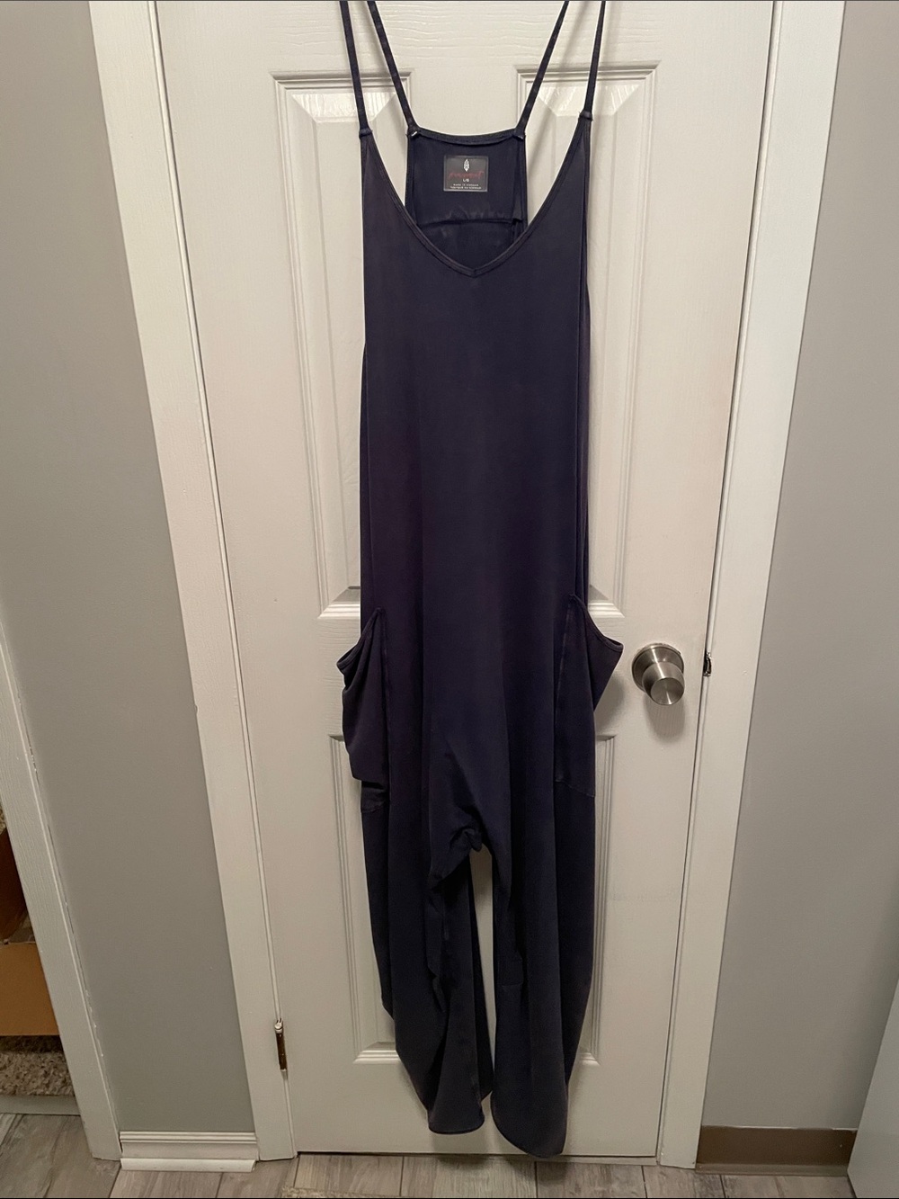 Women’s size large hot shot onesie in wash out navy blue. By  Free People.
